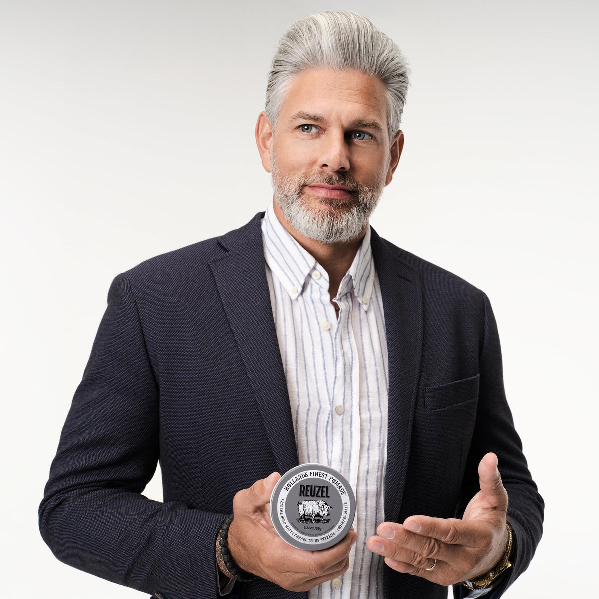 REUZEL Extreme Hold Matte Pomade with hair styling tools