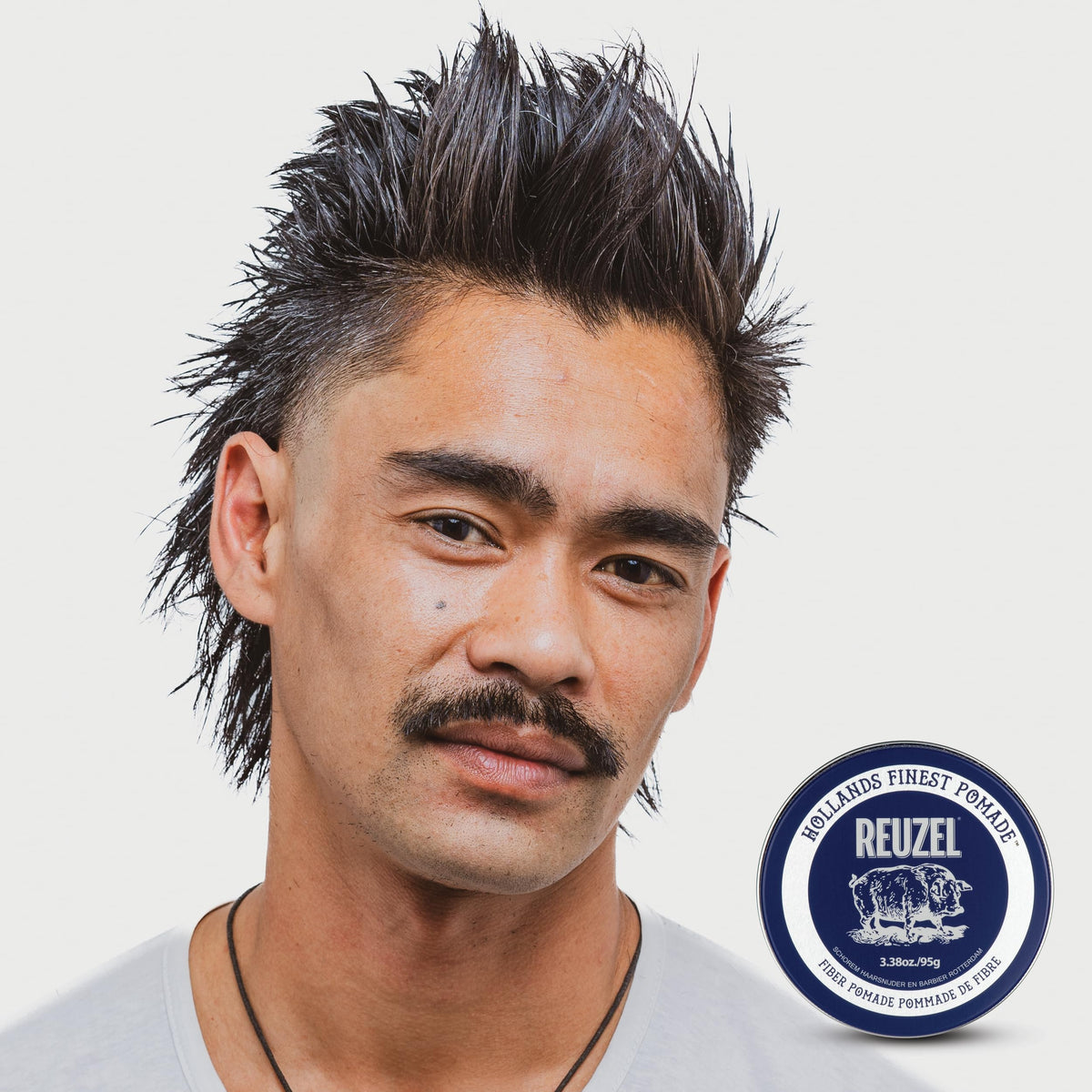 REUZEL Fiber Pomade in bathroom setting