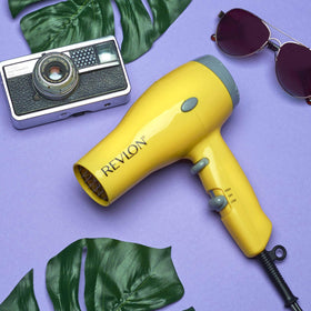 Revlon Compact Ionic Travel Hair Dryer on a bathroom counter