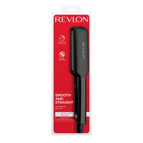 REVLON Flat Iron on a bathroom counter with hair styling products