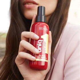 REVLON PROFESSIONAL UniqOne Hair on a bathroom counter
