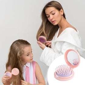 RHOS Folding Hair Brush in use, detangling hair