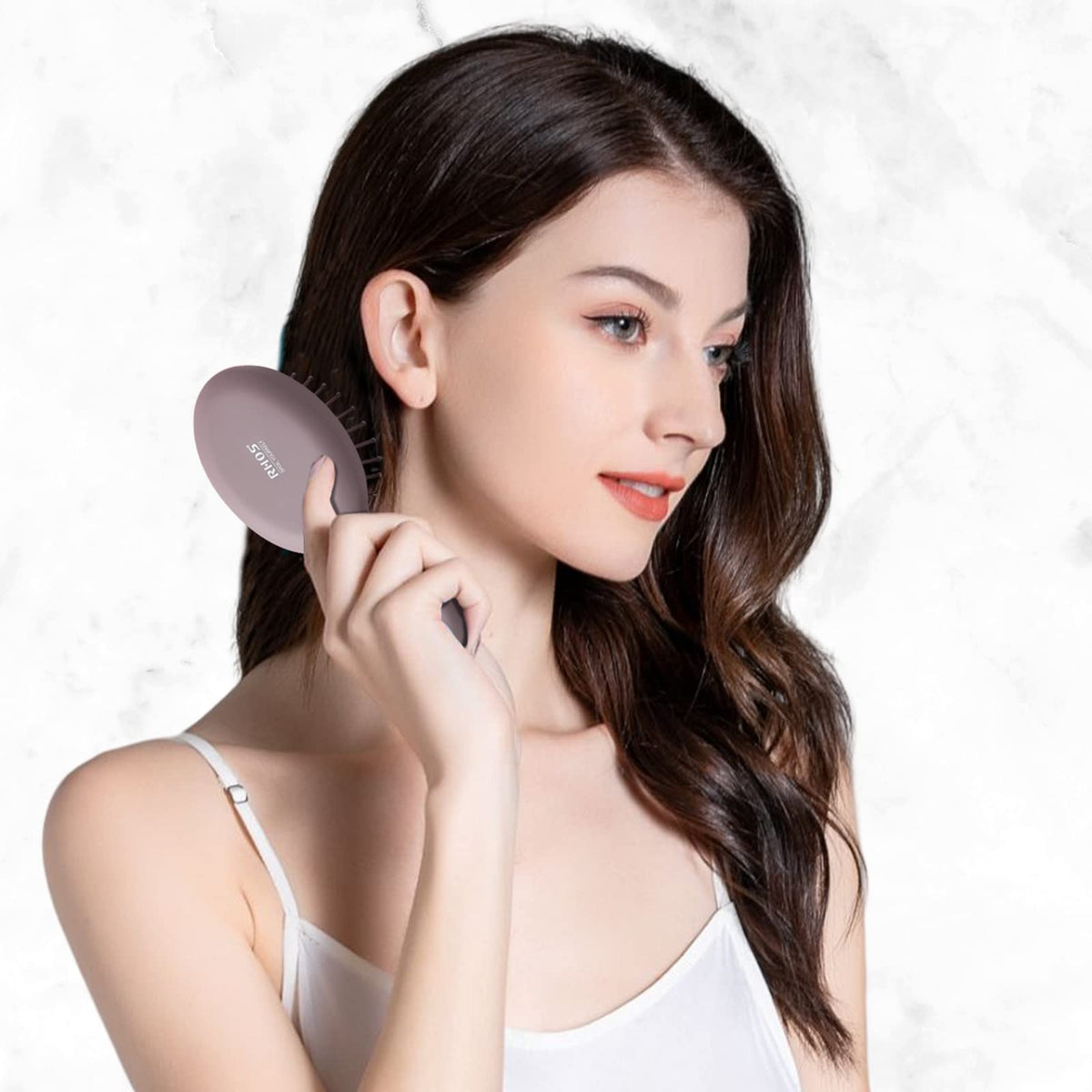 RHOS Mini Hair Brush close-up of the ergonomic handle