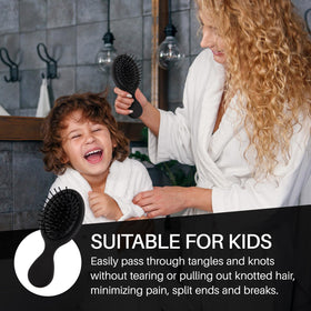 RHOS Mini Hair Brush in use on curly hair
