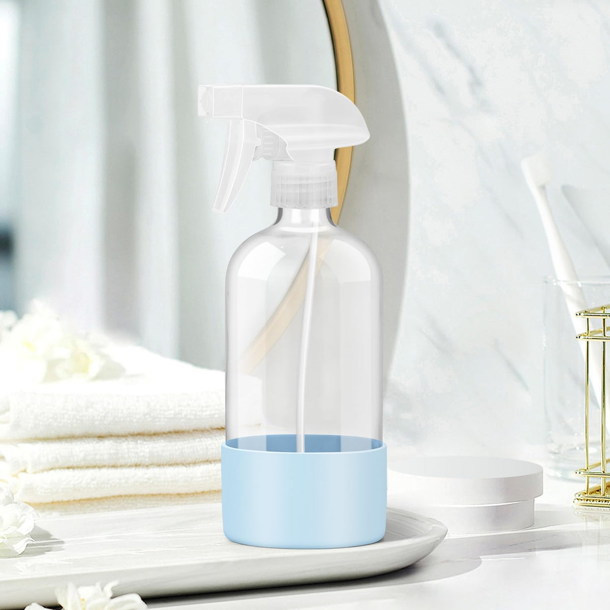 Rionisor glass spray bottle with silicone sleeve in garden