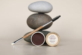 River Organics Dark Brow Wax in a natural setting
