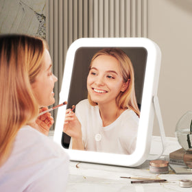 ROLOVE lighted makeup mirror on a desk with makeup tools
