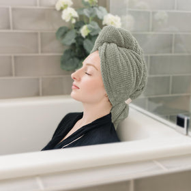 ROLSHOL hair towel wrap in use while applying makeup