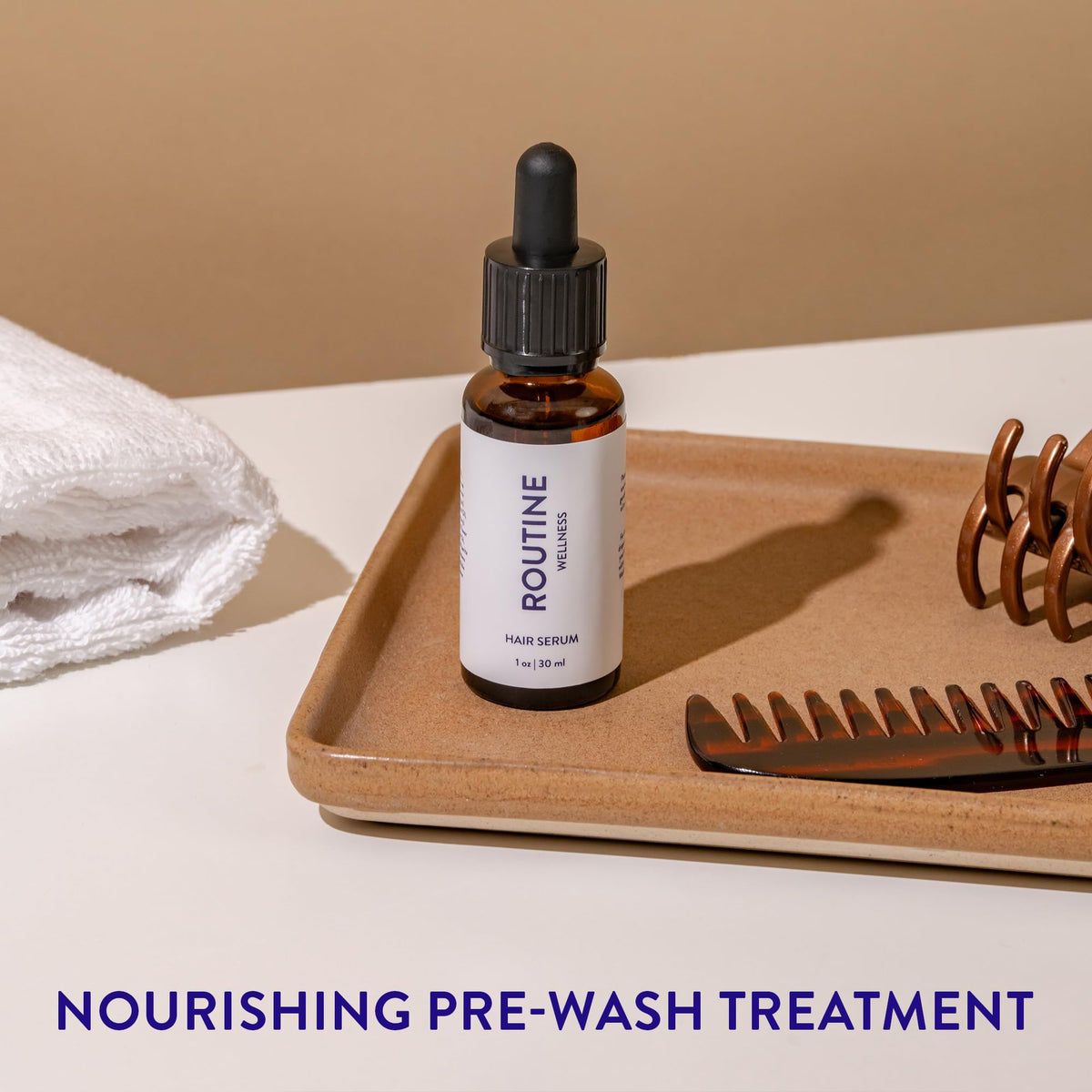 Routine Wellness Hair Serum displayed on a wooden surface