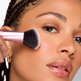RT 459 Ultimate Multi-Tasker Brush in hand demonstrating application
