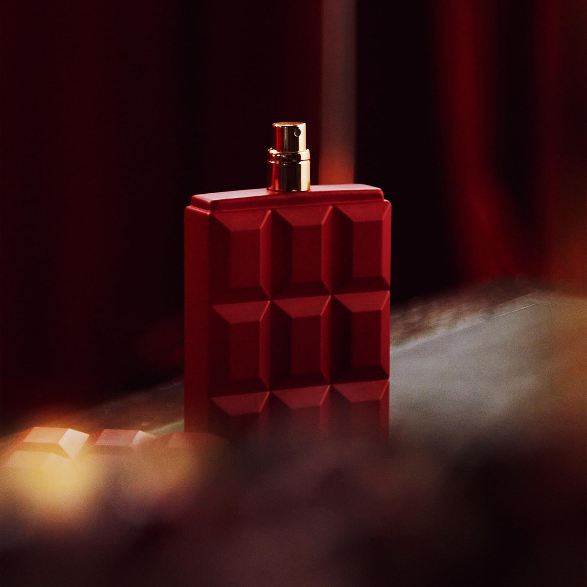 Sabrina Carpenter Cherry Baby Eau de Parfum bottle with cherry and chocolate background