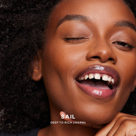 Saie Dew Bronze in natural light on model's cheek