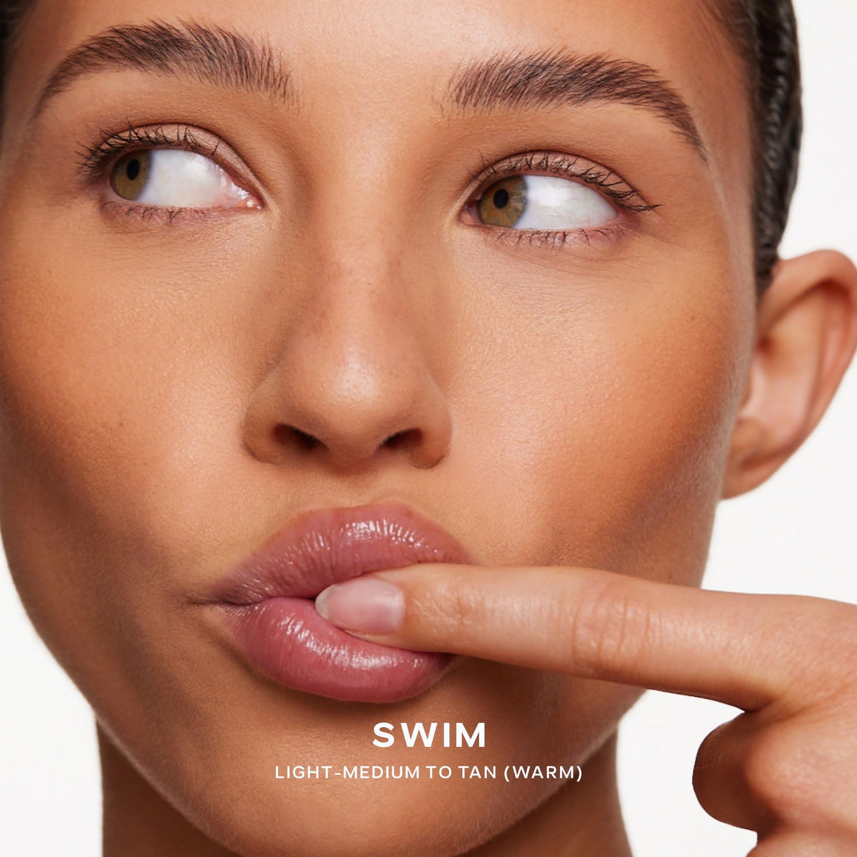 Saie Dew Bronze Liquid Bronzer Stick in natural light