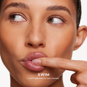Saie Dew Bronze Liquid Bronzer Stick in natural light