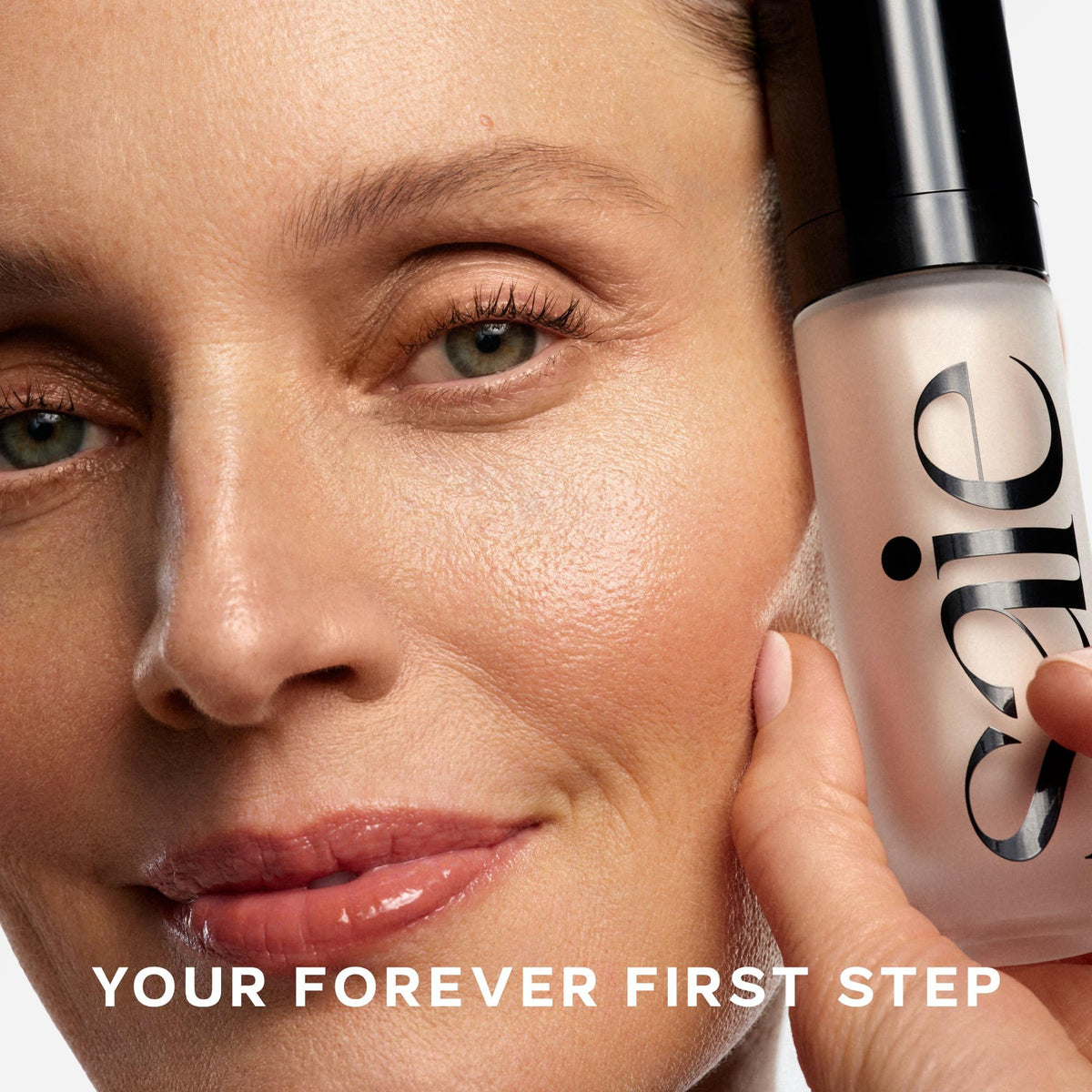 Saie Glowy Super Gel Illuminating Face Primer application on collarbone