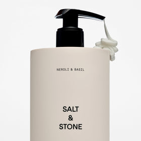 Salt & Stone Body Lotion with fresh basil leaves