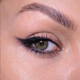 Sandstone Scandinavia Eyeliner Pencil displayed with a makeup brush
