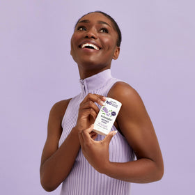 Schmidt's Lavender & Sage Deodorant with lavender flowers