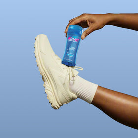 Secret Outlast Antiperspirant Deodorant in hand with clear gel visible