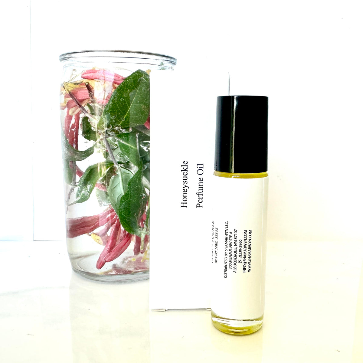 shamarwyn Honeysuckle Perfume Oil roll-on in a purse