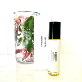 shamarwyn Honeysuckle Perfume Oil roll-on in a purse