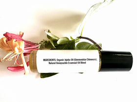 shamarwyn Honeysuckle Perfume Oil roll-on on a wooden table