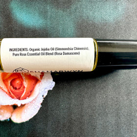 shamarwyn Rose Perfume Oil 10ml roll-on bottle on wooden surface