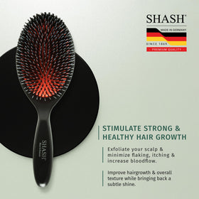 SHASH Boar Bristle Brush on a vanity table