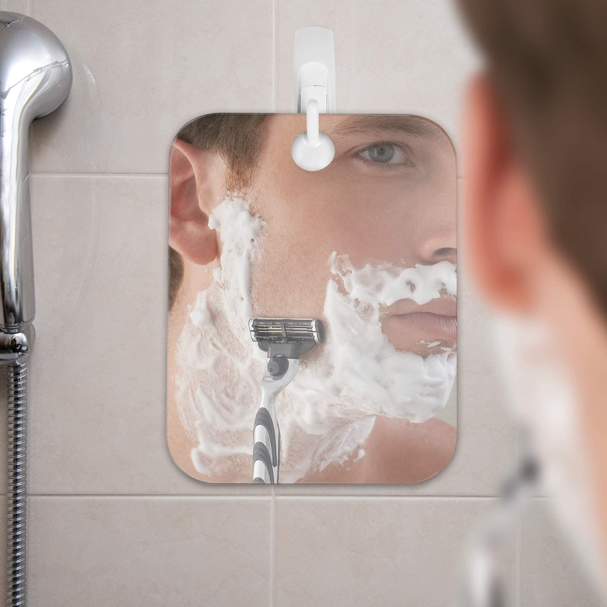 Shave Well Fogless Shower Mirror next to bathroom products
