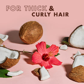 Shea Moisture Curl & Shine Conditioner being applied to hair