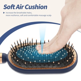 SHINLEA Large Paddle Brush in hand demonstrating ergonomic design