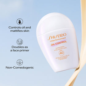Shiseido Urban Environment Oil-Free Sunscreen on vanity with makeup