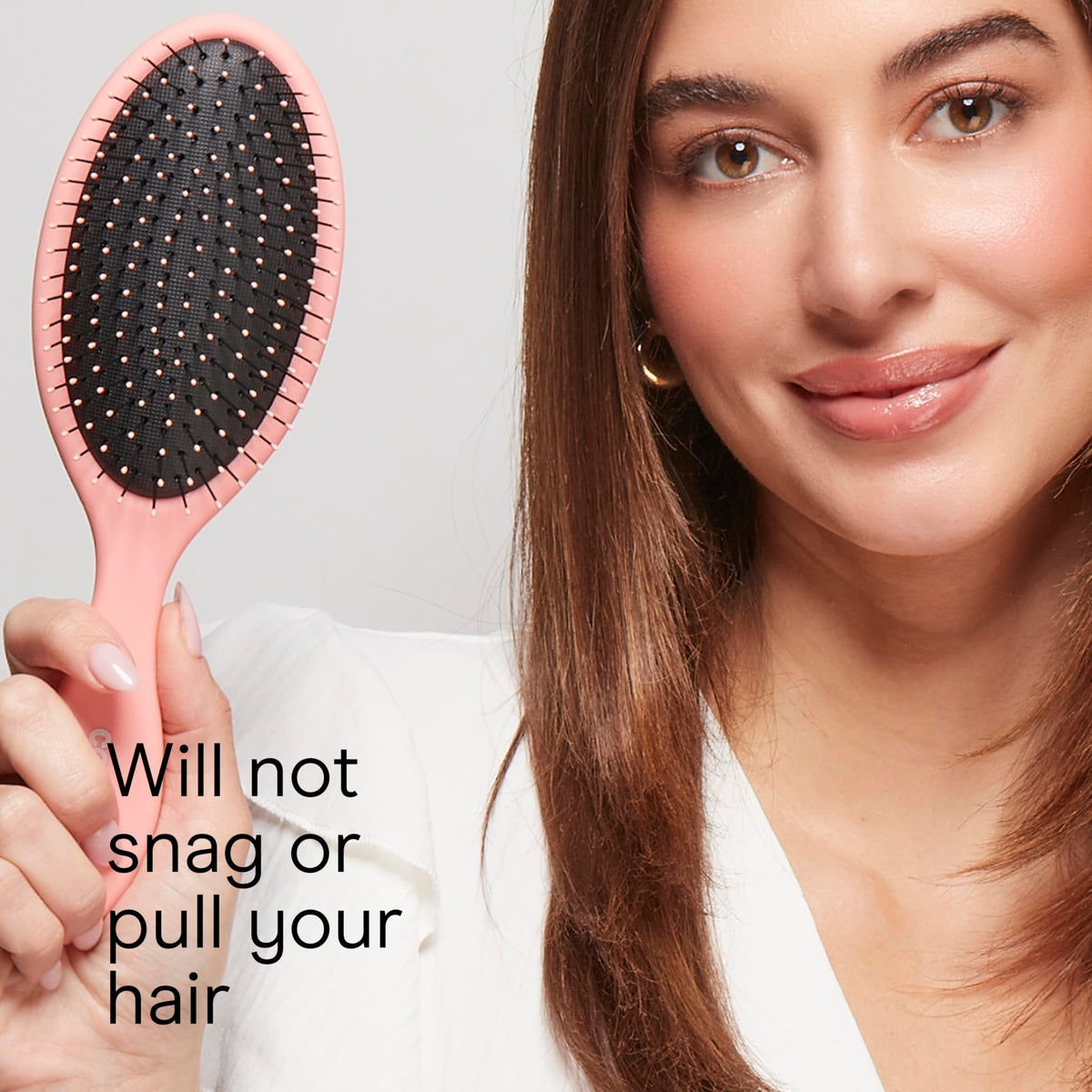 Side view of Conair detangling brush highlighting easy-grip handle
