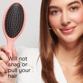 Side view of Conair detangling brush highlighting easy-grip handle