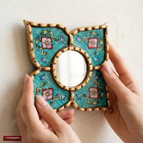 Side view of DecorContreras artisan mirror hanging on wall