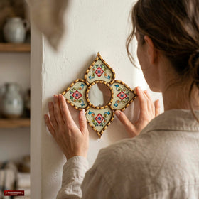 Side view of DecorContreras diamond-shaped mirror