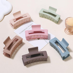 Sisiaipu Square Hair Clips held in hand demonstrating their medium size