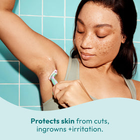 Skintimate 2-in-1 Shave Oil & Moisturizer on bathroom counter