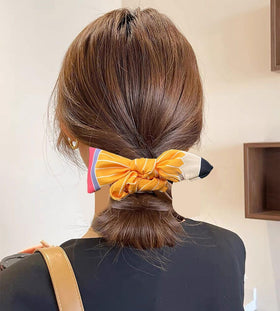 SKIRIFLA Teacher Hair Accessories Pencil Bow Headband on a model