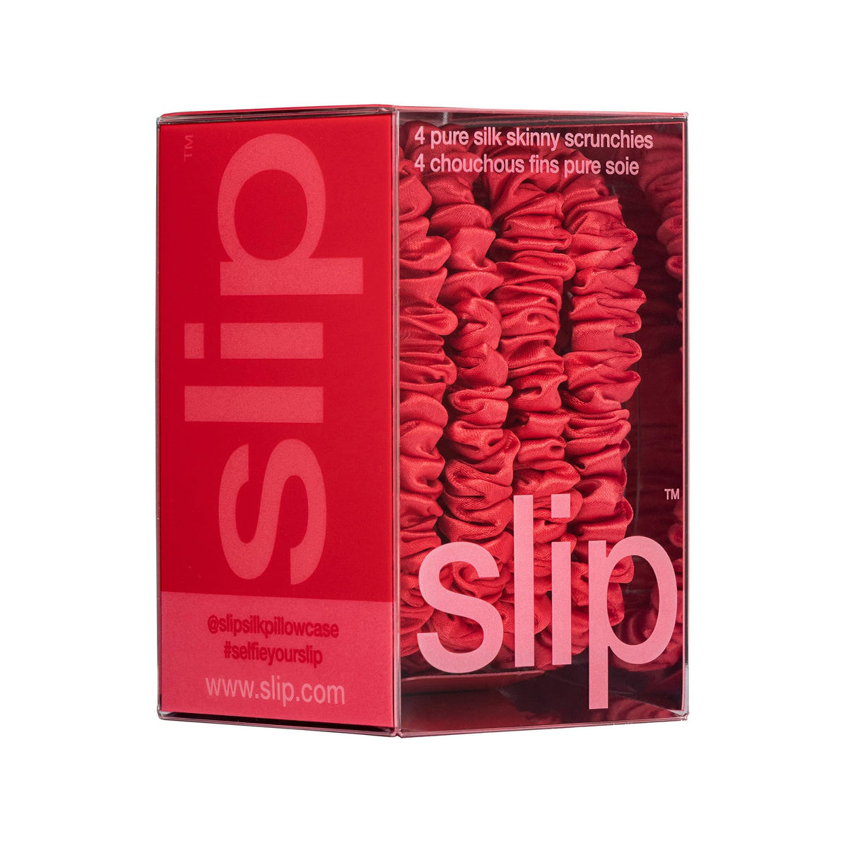 SLIP red silk scrunchies on a model's wrist