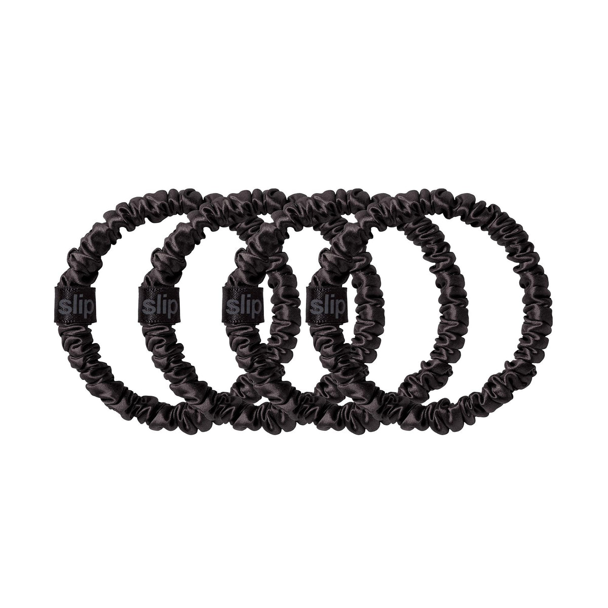 SLIP Silk Hair Ties Set of 4 arranged with other hair accessories