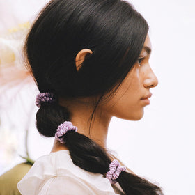 SLIP Silk Hair Ties Wildflower Skinny Scrunchies on a model's hair