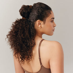 SLIP silk scrunchies displayed on a vanity