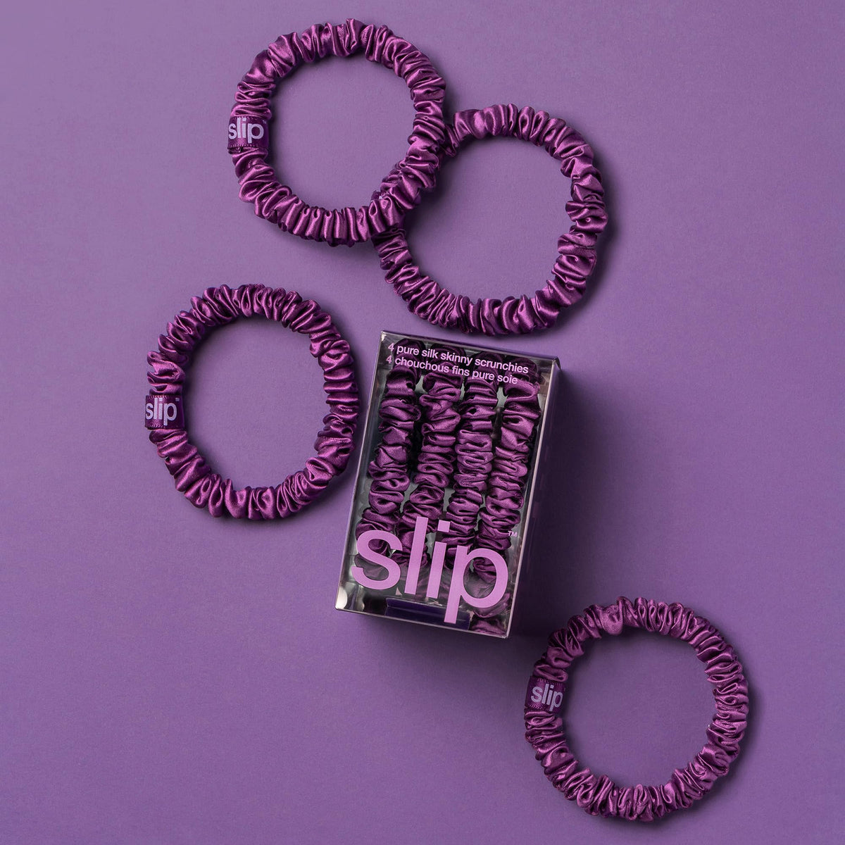 SLIP skinny scrunchies in dark purple on a white background