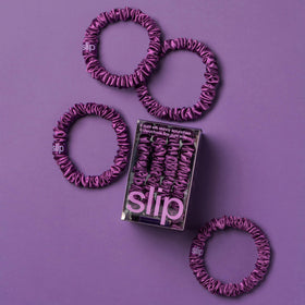 SLIP skinny scrunchies in dark purple on a white background