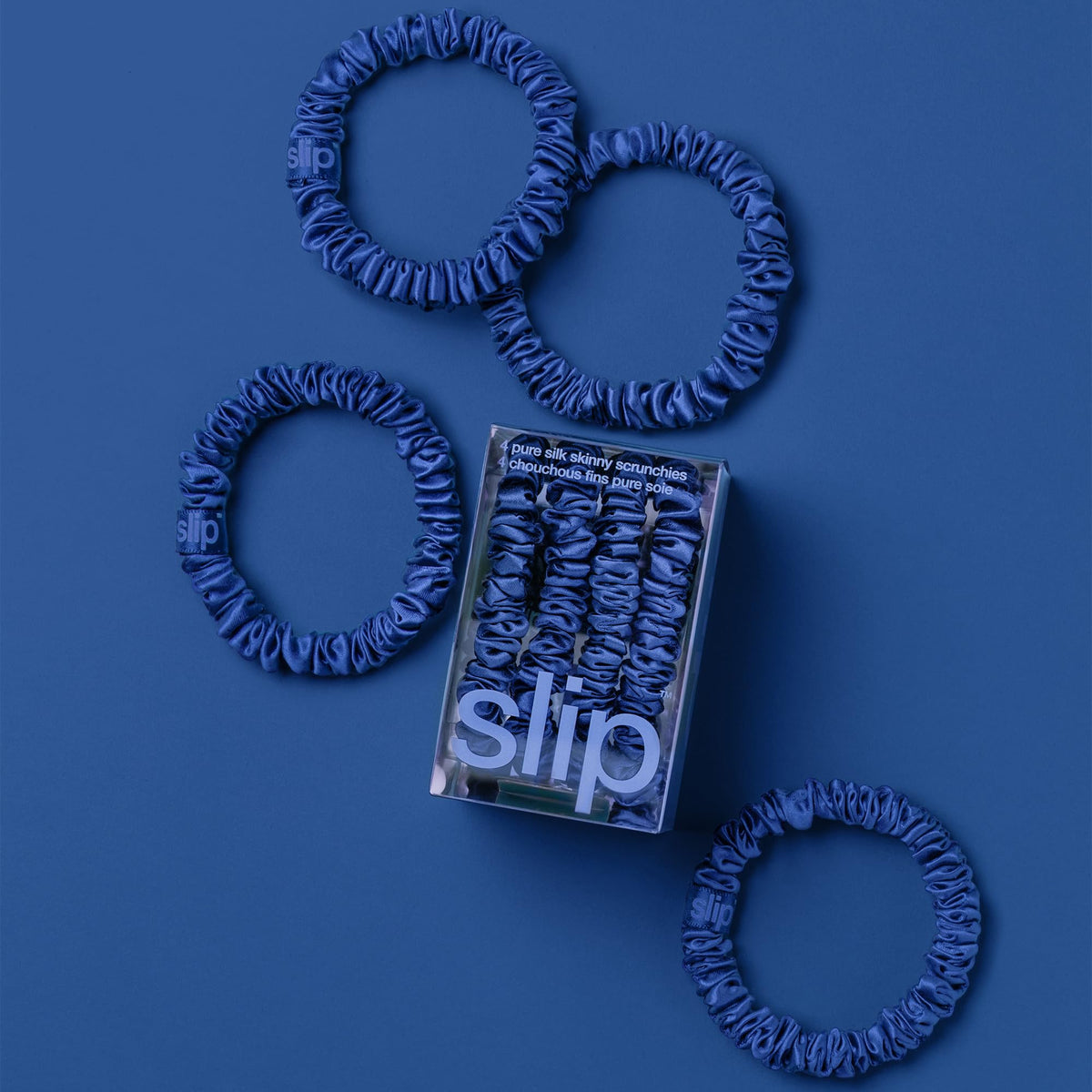 SLIP Skinny Silk Scrunchies displayed in a stylish arrangement
