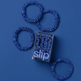 SLIP Skinny Silk Scrunchies displayed in a stylish arrangement
