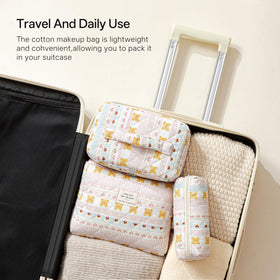 Small HBselect makeup bag with cosmetic items inside