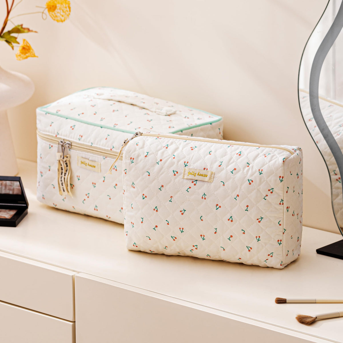 Small HBselect makeup bag with floral pattern on a vanity