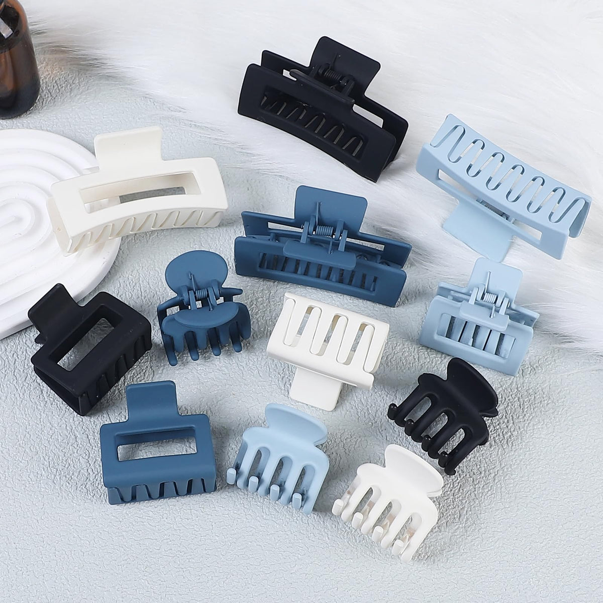 SMKSL hair claw clips in various styles on display